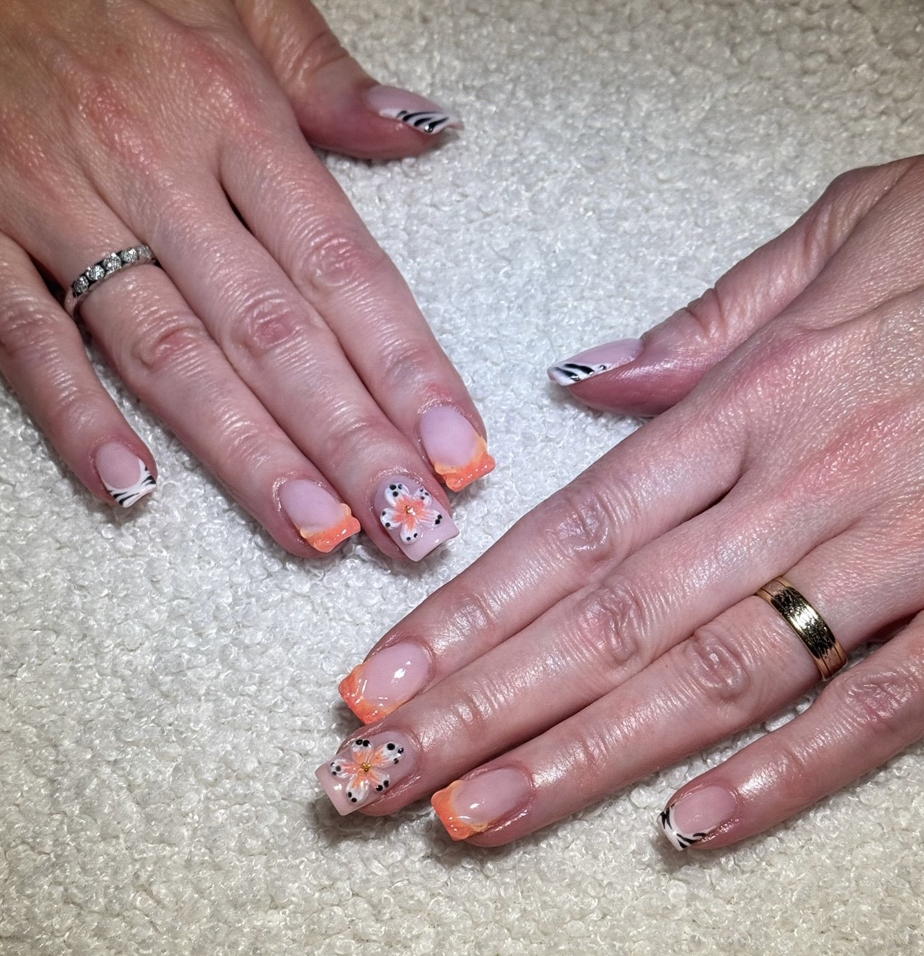 Happy client showing beautiful nail results